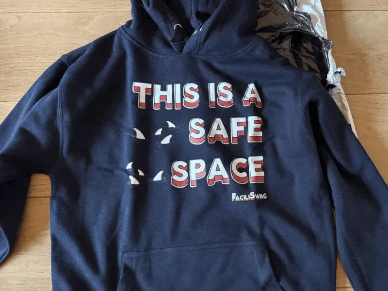 Lucie modeling FaciliSwag merch